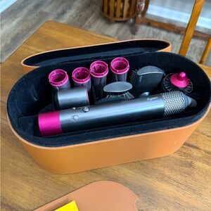 Dyson Airwrap Styling Set with Fuchsia accent color.